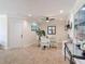 Cozy dining area featuring a glass table, white chairs, and seamless transitions to the living spaces enhancing the room's appeal at 86 Rains Ct, Ponce Inlet, FL 32127