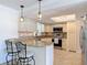 Kitchen featuring granite countertops, stainless steel appliances, and pendant lighting at 86 Rains Ct, Ponce Inlet, FL 32127