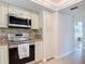 Close up shot of a well-equipped kitchen with stainless steel appliances and granite countertops at 86 Rains Ct, Ponce Inlet, FL 32127