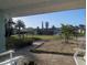 Charming view from the front porch showcasing the neighborhood and highlighting the proximity to the nearby lighthouse at 86 Rains Ct, Ponce Inlet, FL 32127