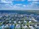 Expansive aerial view of homes near a large wooded area, showcasing a serene and scenic neighborhood at 905 Maple St, New Smyrna Beach, FL 32169