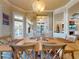 Dining area featuring wood floors, stylish furniture, and decorative elements at 905 Maple St, New Smyrna Beach, FL 32169