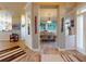 Foyer with wood floors leading to a dining area, art pieces and decorative elements at 905 Maple St, New Smyrna Beach, FL 32169