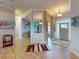 Charming foyer with art displays, hardwood floors, and an open floor plan leading to the rest of the home at 905 Maple St, New Smyrna Beach, FL 32169