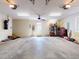 Spacious garage featuring ample storage, ceiling fan, and an abundance of lighting at 905 Maple St, New Smyrna Beach, FL 32169