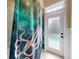 Unique shower curtain with an octopus design near the door at 905 Maple St, New Smyrna Beach, FL 32169