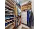 Organized walk-in closet with built-in shelving and ample storage space for clothes and accessories at 905 Maple St, New Smyrna Beach, FL 32169