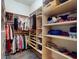 A spacious walk-in closet with custom shelving and hanging rods offers ample storage for clothes and accessories at 905 Maple St, New Smyrna Beach, FL 32169