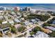 Aerial view of a beach community featuring beachfront condos and palm tree-lined streets at 910 Maple St # A & B, New Smyrna Beach, FL 32169