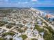 Aerial view of the neighborhood showcasing the beaches, various local businesses, and residential homes at 910 Maple St # A & B, New Smyrna Beach, FL 32169