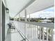 Balcony with two chairs offers a view of the neighborhood at 910 Maple St # A & B, New Smyrna Beach, FL 32169