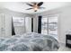 Bright bedroom features a ceiling fan and sliding glass doors to the deck at 910 Maple St # A & B, New Smyrna Beach, FL 32169