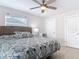 Inviting bedroom featuring a ceiling fan and plenty of closet space at 910 Maple St # A & B, New Smyrna Beach, FL 32169