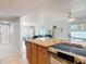 View of the kitchen island facing into the dining and living area at 910 Maple St # A & B, New Smyrna Beach, FL 32169