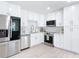 Bright kitchen with stainless steel appliances, white cabinets, countertops and subway tile backsplash at 910 Maple St # A & B, New Smyrna Beach, FL 32169