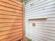 Outdoor shower space is adjacent to a wooden fence and the home's exterior wall at 910 Maple St # A & B, New Smyrna Beach, FL 32169