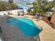 Aerial view of the inviting backyard with sparkling pool, jacuzzi and landscaping at 910 Maple St # A & B, New Smyrna Beach, FL 32169