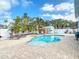 Inviting backyard features a sparkling pool, jacuzzi, shed and exterior kitchen at 910 Maple St # A & B, New Smyrna Beach, FL 32169