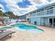 Inviting backyard features a sparkling pool, jacuzzi and shed at 910 Maple St # A & B, New Smyrna Beach, FL 32169