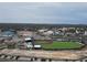 Aerial view of a minor league baseball field surrounded by town and trees at 944 S Peninsula Dr # 5010, Daytona Beach, FL 32118