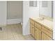 This full bathroom features a wood vanity, tile flooring, toilet, bidet, and tub at 944 S Peninsula Dr # 5010, Daytona Beach, FL 32118