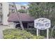 View of building, parking, and sign for Pier 43 in a waterfront community in New Smyrna Beach, Florida at 944 S Peninsula Dr # 5010, Daytona Beach, FL 32118