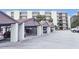 Covered carports featuring a well-maintained parking area outside of the condominium building at 944 S Peninsula Dr # 5010, Daytona Beach, FL 32118