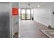 Hallway with brick flooring, emergency exit and elevator signage near a unit entrance at 944 S Peninsula Dr # 5010, Daytona Beach, FL 32118