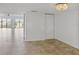 Bright living room featuring tiled floors, expansive windows, neutral wall colors, and elegant lighting at 944 S Peninsula Dr # 5010, Daytona Beach, FL 32118