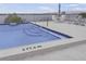 Rooftop pool featuring an umbrella table and two lounge chairs with striped cushions at 944 S Peninsula Dr # 5010, Daytona Beach, FL 32118