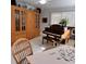 Living room featuring a piano, hutch, and puzzle on the table, showcasing the home's versatility at 2380 Captain Butler Trl, New Smyrna Beach, FL 32168