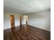 Bedroom featuring hardwood floors, neutral walls, and access to other rooms at 101 N Riverside Dr # 2090, New Smyrna Beach, FL 32168