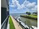 Beautiful waterfront view with boat docks and lush landscaping at 101 N Riverside Dr # 2090, New Smyrna Beach, FL 32168