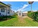 Well-maintained backyard with lush lawn and a storage shed at 105 Azalea Cir, New Smyrna Beach, FL 32168
