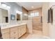Bright bathroom featuring double vanity with modern fixtures and a glass-enclosed shower at 105 Azalea Cir, New Smyrna Beach, FL 32168