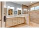 Bathroom featuring double vanity with modern fixtures and a glass-enclosed shower at 105 Azalea Cir, New Smyrna Beach, FL 32168