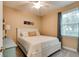 Bright bedroom with white furniture and a ceiling fan at 105 Azalea Cir, New Smyrna Beach, FL 32168