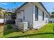Exterior view showing a Generac generator and screen enclosed lanai at 105 Azalea Cir, New Smyrna Beach, FL 32168