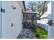 Enjoy an open-air shower near the screened lanai with a paved stone pathway at 105 Azalea Cir, New Smyrna Beach, FL 32168