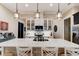 Modern kitchen featuring a spacious island, pendant lighting, and stainless steel appliances at 105 Azalea Cir, New Smyrna Beach, FL 32168
