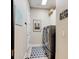 Clean laundry room with modern appliances and a stylish patterned rug at 105 Azalea Cir, New Smyrna Beach, FL 32168