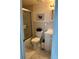 Well-lit bathroom features a tiled shower with glass door and modern vanity at 1111 Hill St # U27, New Smyrna Beach, FL 32169