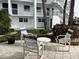 Relaxing courtyard featuring outdoor seating and tropical landscaping at 1111 Hill St # U27, New Smyrna Beach, FL 32169