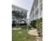 Exterior view of the building with green landscaping at 1111 Hill St # U27, New Smyrna Beach, FL 32169