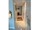 Bright hallway with tile flooring and convenient access to rooms at 1111 Hill St # U27, New Smyrna Beach, FL 32169