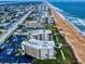 An expansive aerial shot of the condos, nestled beside the tranquil ocean at 1275 Ocean Shore Blvd # 5050, Ormond Beach, FL 32176