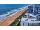 Aerial view of the condo buildings, beach, and ocean at 1275 Ocean Shore Blvd # 5050, Ormond Beach, FL 32176