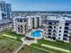 Aerial view of the condos with a shared pool and a grilling cabana for outdoor entertaining at 1275 Ocean Shore Blvd # 5050, Ormond Beach, FL 32176