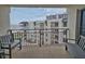 Balcony view of the ocean, pool, and nearby resort at 1275 Ocean Shore Blvd # 5050, Ormond Beach, FL 32176