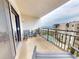 Relaxing condo balcony featuring comfortable seating and views of the pool and ocean at 1275 Ocean Shore Blvd # 5050, Ormond Beach, FL 32176